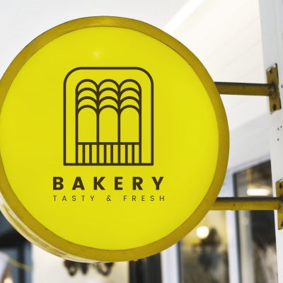 Bakery store's yellow shop sign mockup